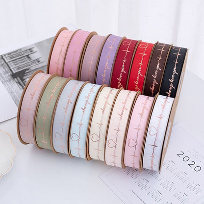 SH-2.5 cm woven ribbon, fresh flower packaging ribbon, floral art hot-stamped spiral pattern satin ribbon, English alphabet bouquet cake gift ribbon.